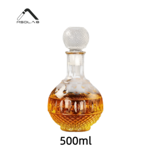 Intricately carved 500ml glass whiskey bottle with a round crystal-cut stopper, filled with golden liquor.