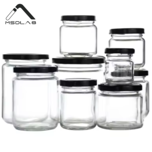 A set of various sized square glass storage jars with natural bamboo lids, filled with pasta, beans, and snacks on a white background.